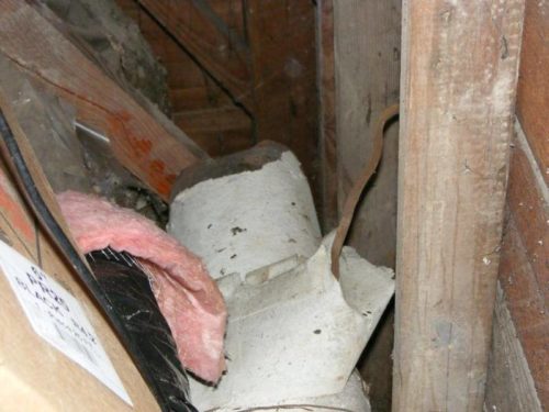 Abandoned Ductwork with suspected asbestos paper insulation