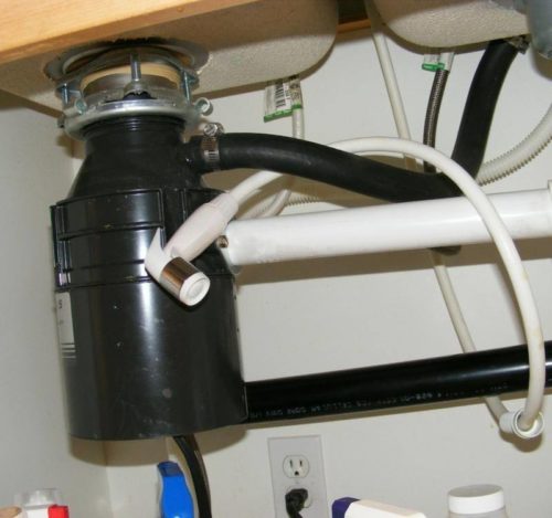 Handy sprayer right under the kitchen sink