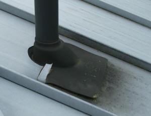 Rubber boot pipe flashing on steel roof